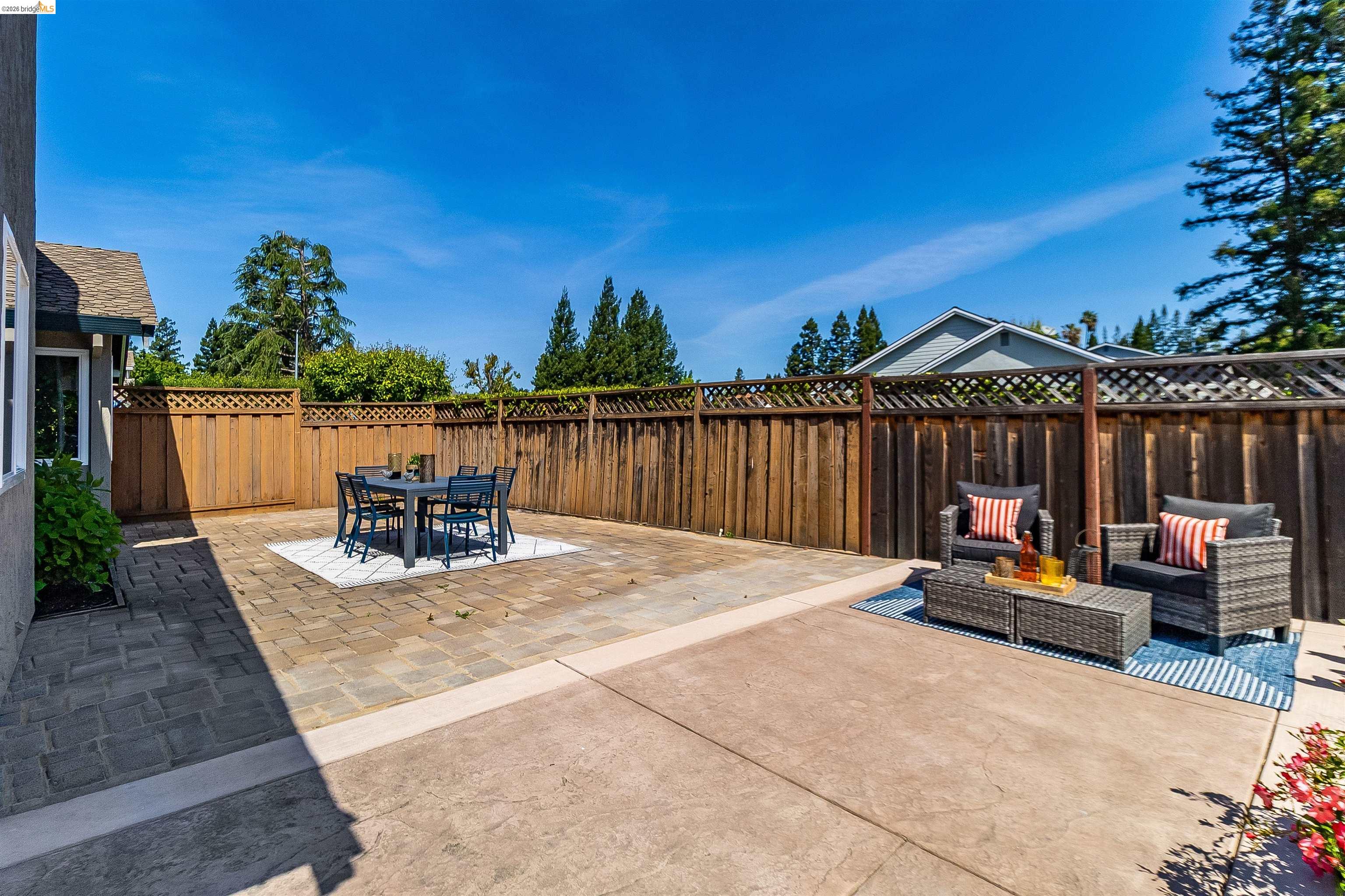 9980 Mangos Drive San Ramon, CA 94583 - Photo 34 of 41 Fenced backyard with a patio and outdoor lounge area