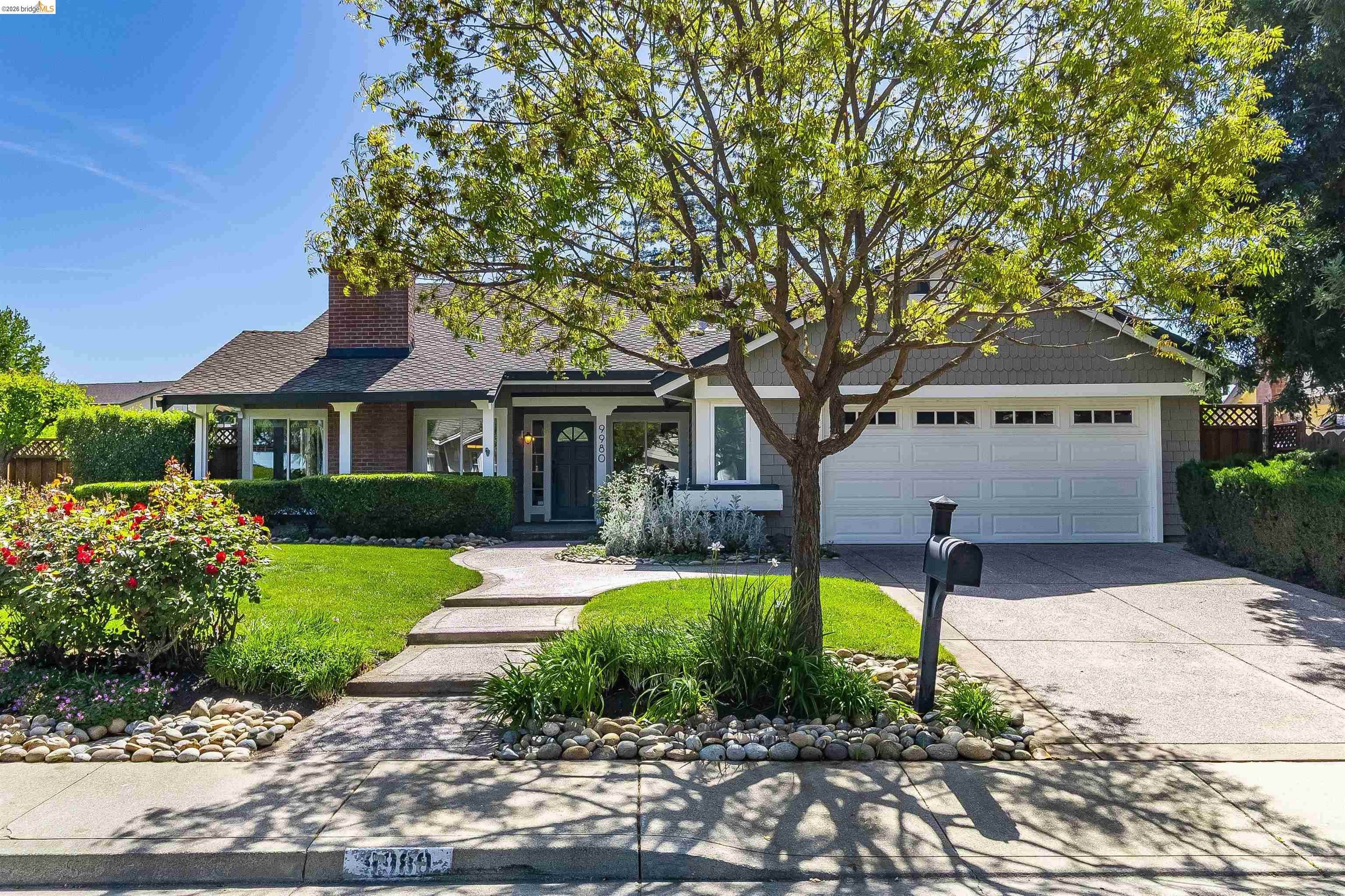 9980 Mangos Drive San Ramon, CA 94583 - Photo 40 of 41 View of front of property featuring a chimney, driveway, a front lawn, an attached garage, and a shingled roof