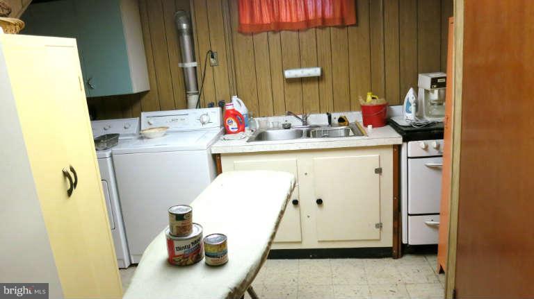1547 South Rolling Road Baltimore, MD 21227 - Photo 22 of 26 laundry room includes sink and stove