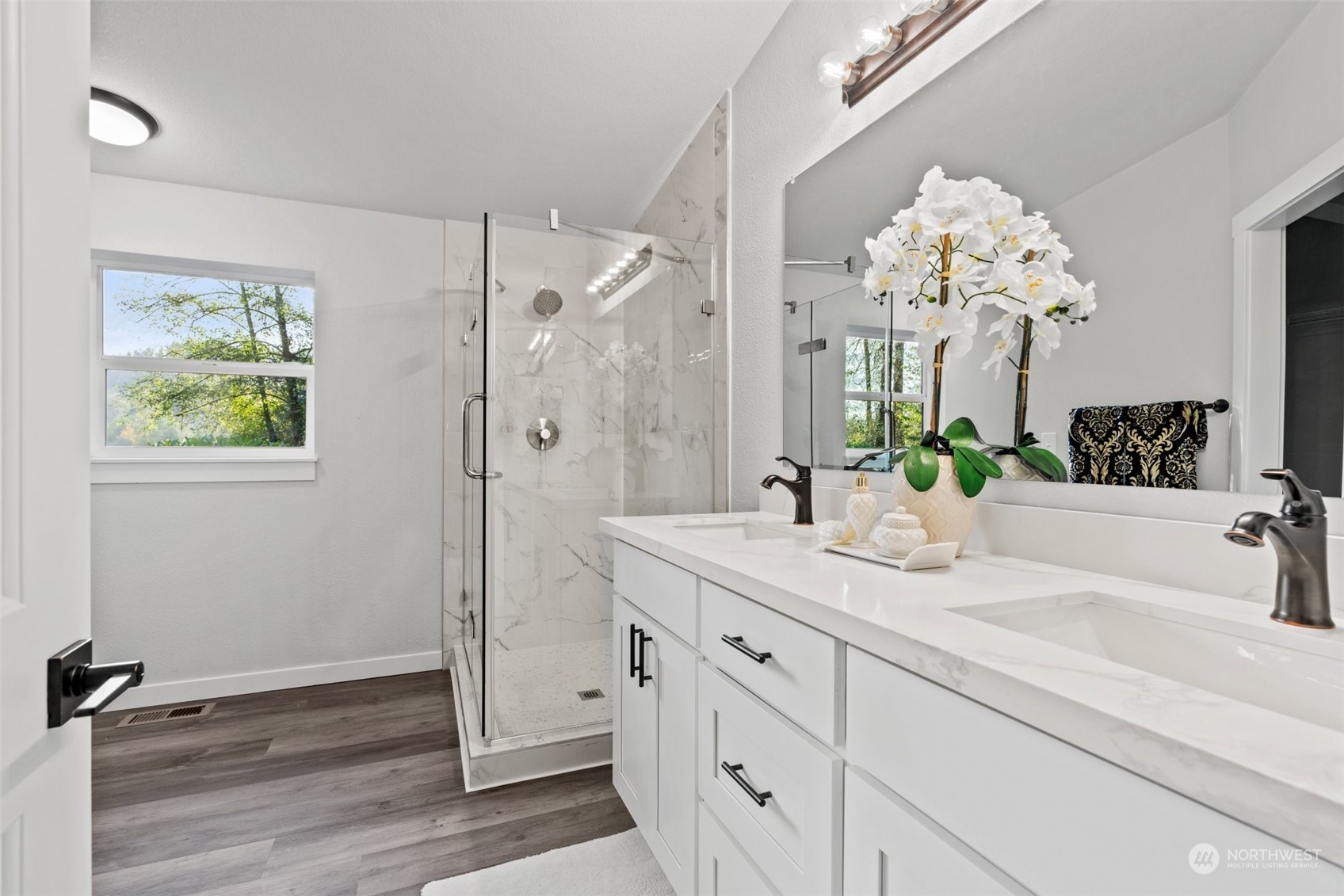 13314 Spring Site Road East Orting, WA 98360 - Photo 19 of 28 a bathroom with a sink mirror and vanity