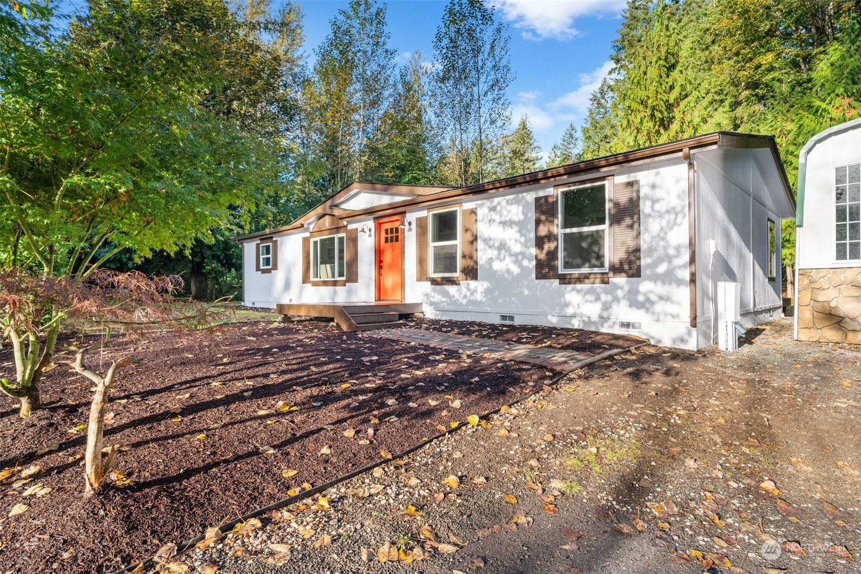 13314 Spring Site Road East Orting, WA 98360 - Photo 3 of 28 a front view of a house with a yard
