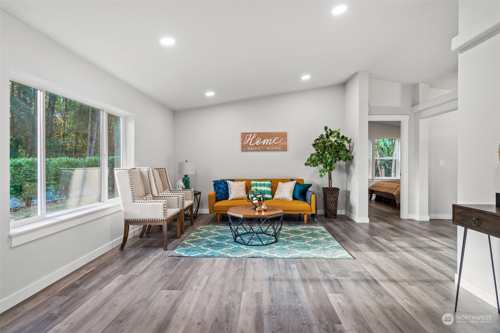 13314 Spring Site Road East Orting, WA 98360 - Photo 4 of 28 a living room with furniture and a wooden floor