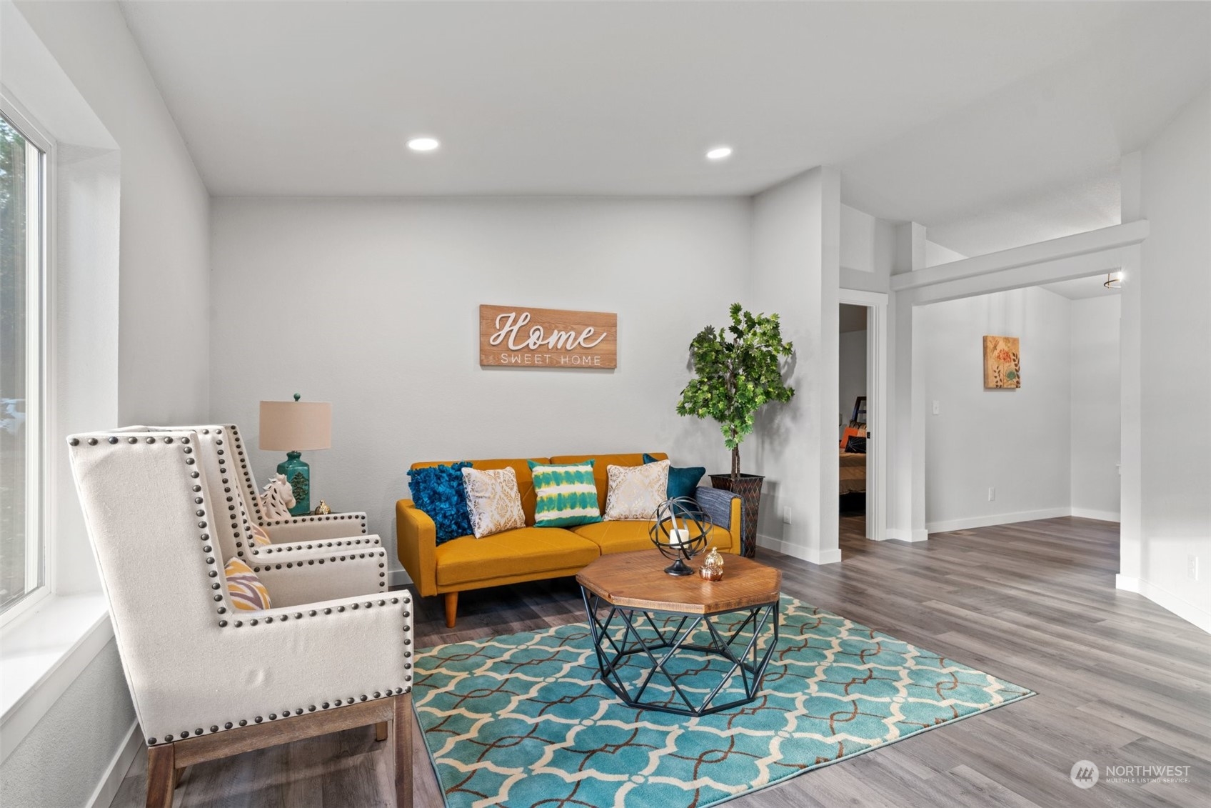 13314 Spring Site Road East Orting, WA 98360 - Photo 5 of 28 a living room with furniture and a rug