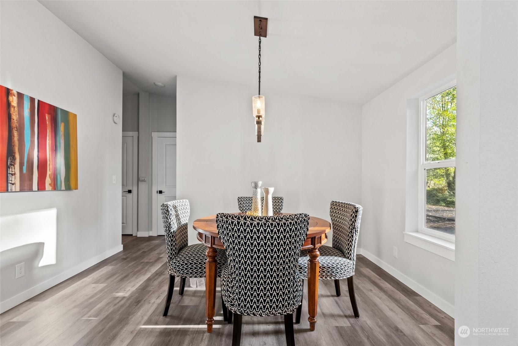 13314 Spring Site Road East Orting, WA 98360 - Photo 10 of 28 a view of a dining room with furniture window and wooden floor