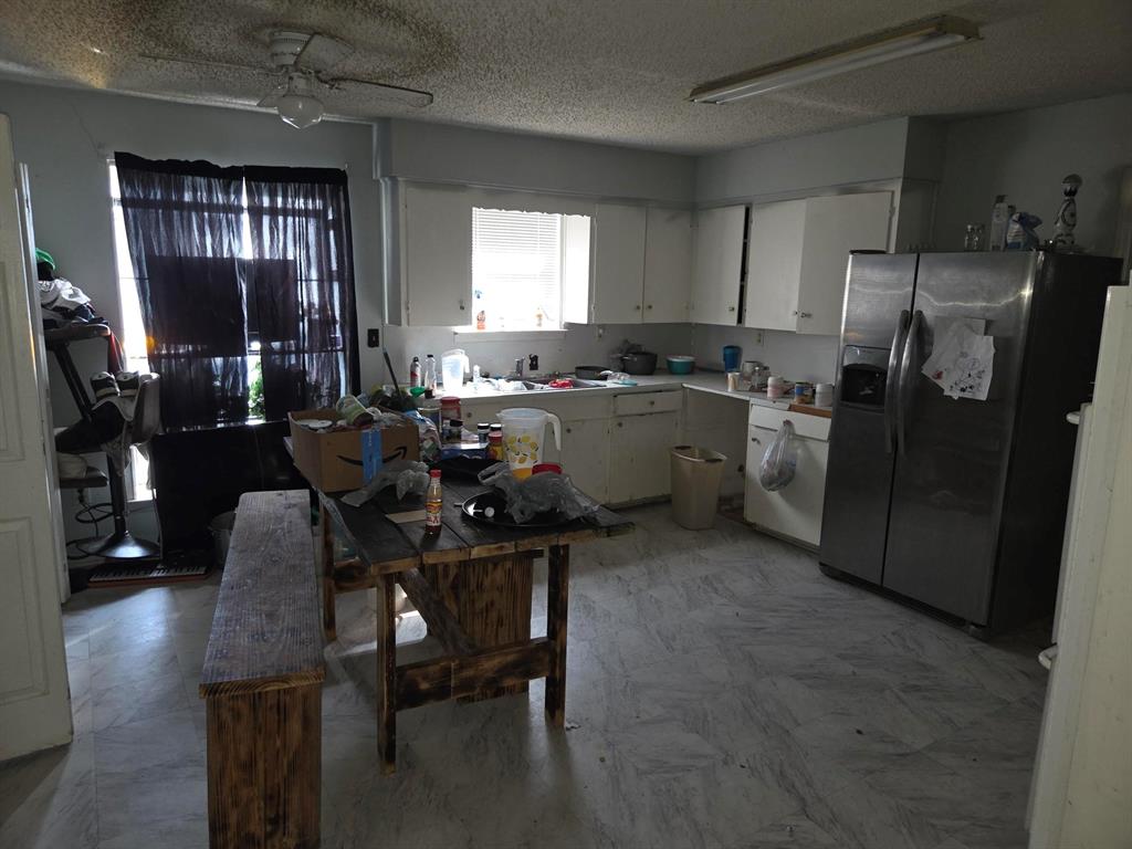 105 Royal Lane Princeton, TX 75407 - Photo 12 of 14 a kitchen with refrigerator and window
