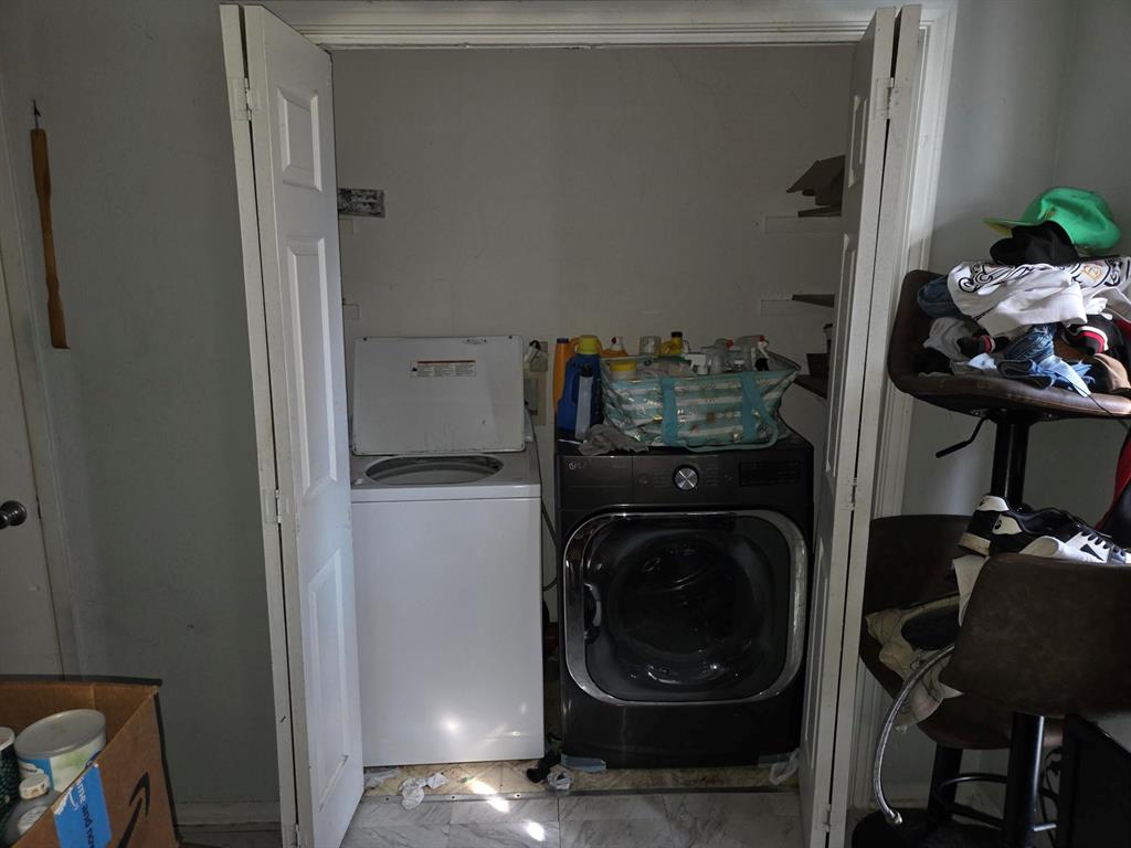 105 Royal Lane Princeton, TX 75407 - Photo 13 of 14 a utility room with wooden floor washer and dryer