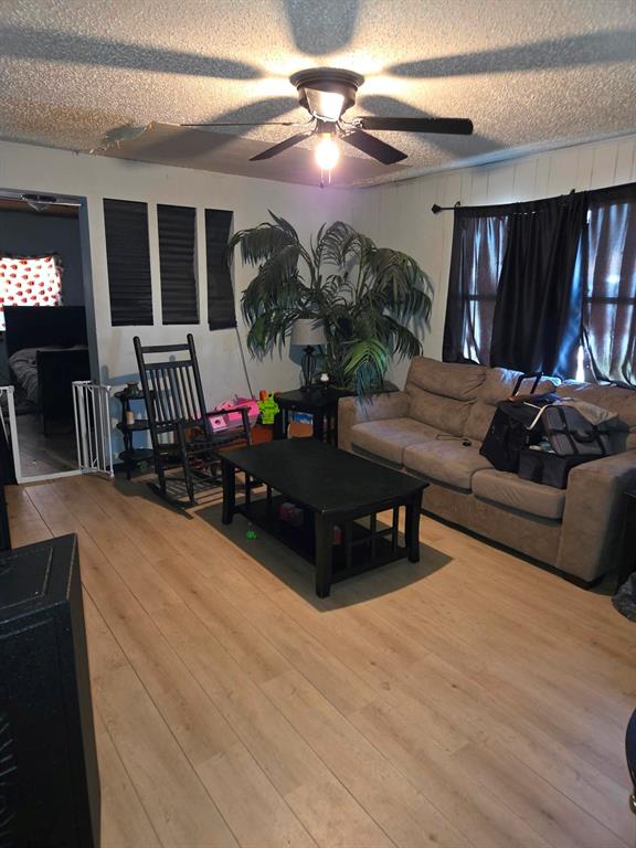 105 Royal Lane Princeton, TX 75407 - Photo 9 of 14 a living room with furniture and a potted plant
