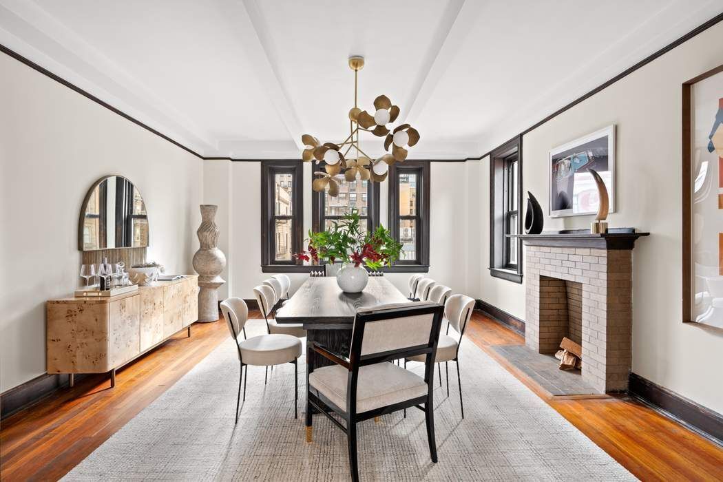 257 West 86th Street, Unit 78B Manhattan, NY 10024 - Photo 3 of 14 a view of a dining room with furniture and a fireplace