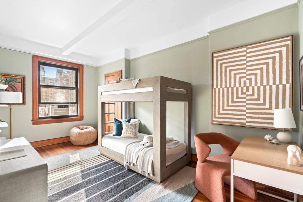 257 West 86th Street, Unit 78B Manhattan, NY 10024 - Photo 8 of 14 a bedroom with furniture and a window