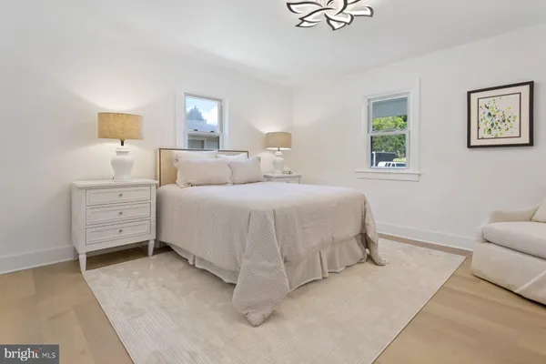 a bedroom with a bed and a couch