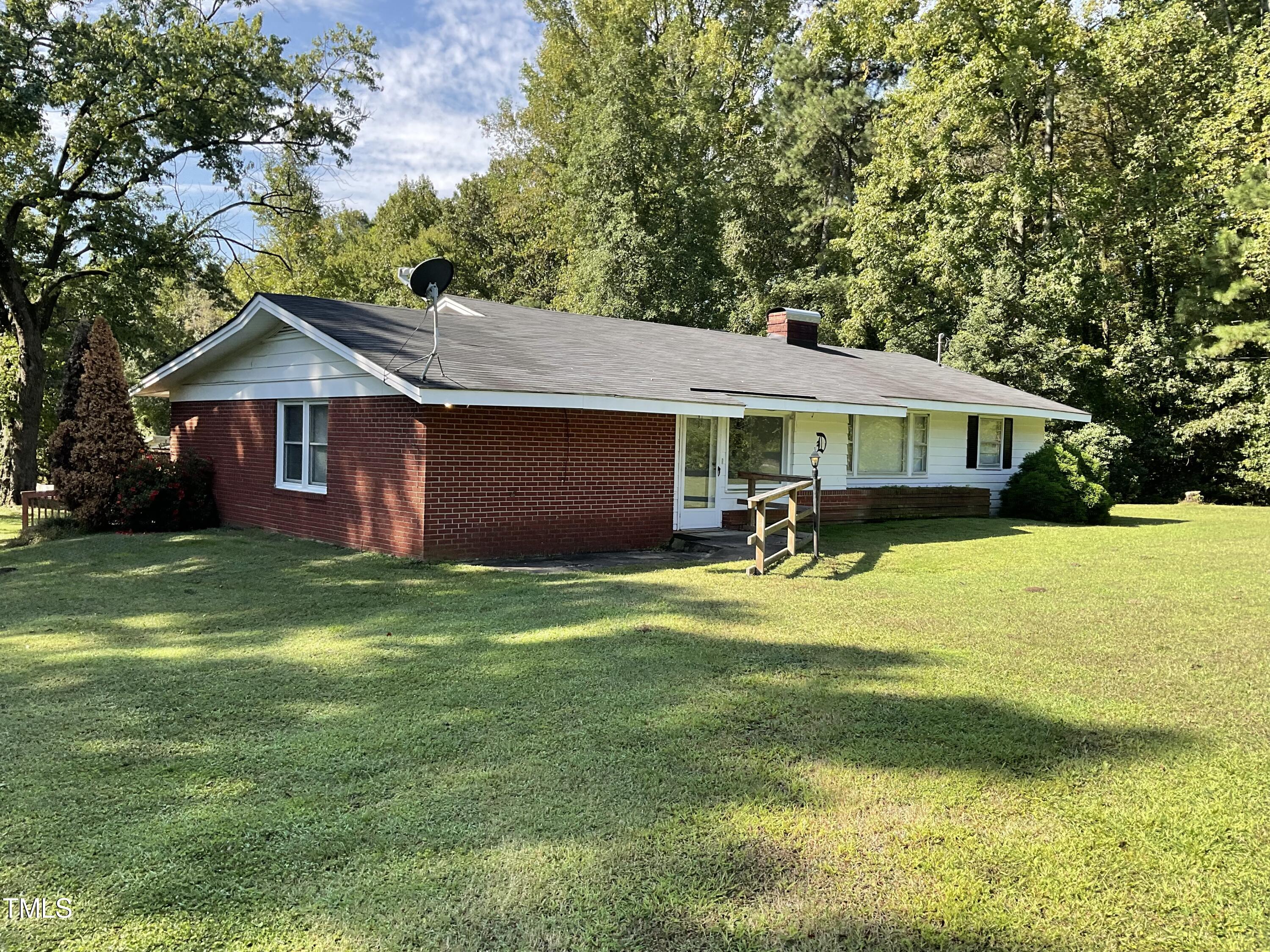 4540 Benson Road Angier, NC 27501 - Photo 1 of 27 a house with swimming pool
