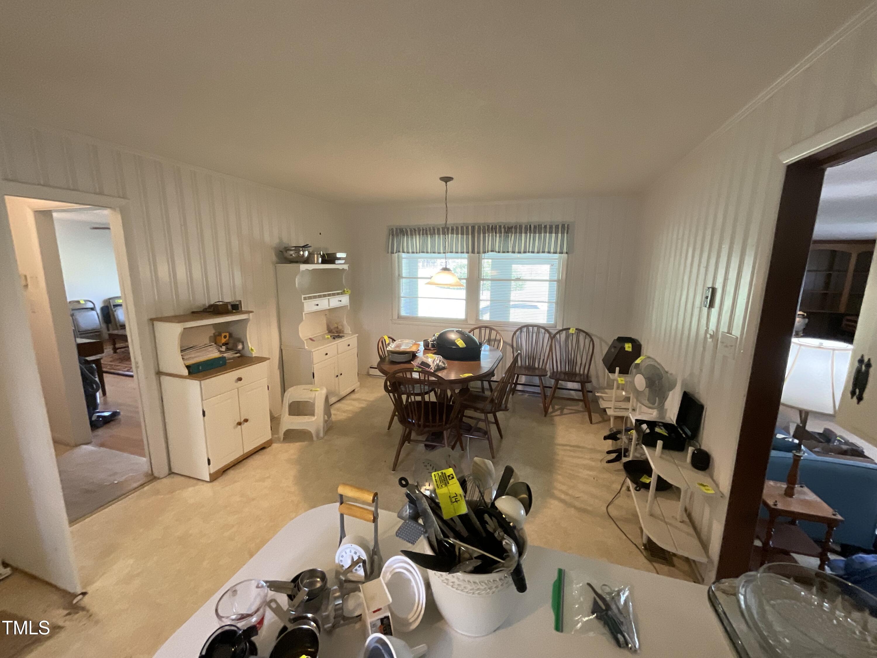 4540 Benson Road Angier, NC 27501 - Photo 15 of 27 a living room with furniture a large window and gym equipment