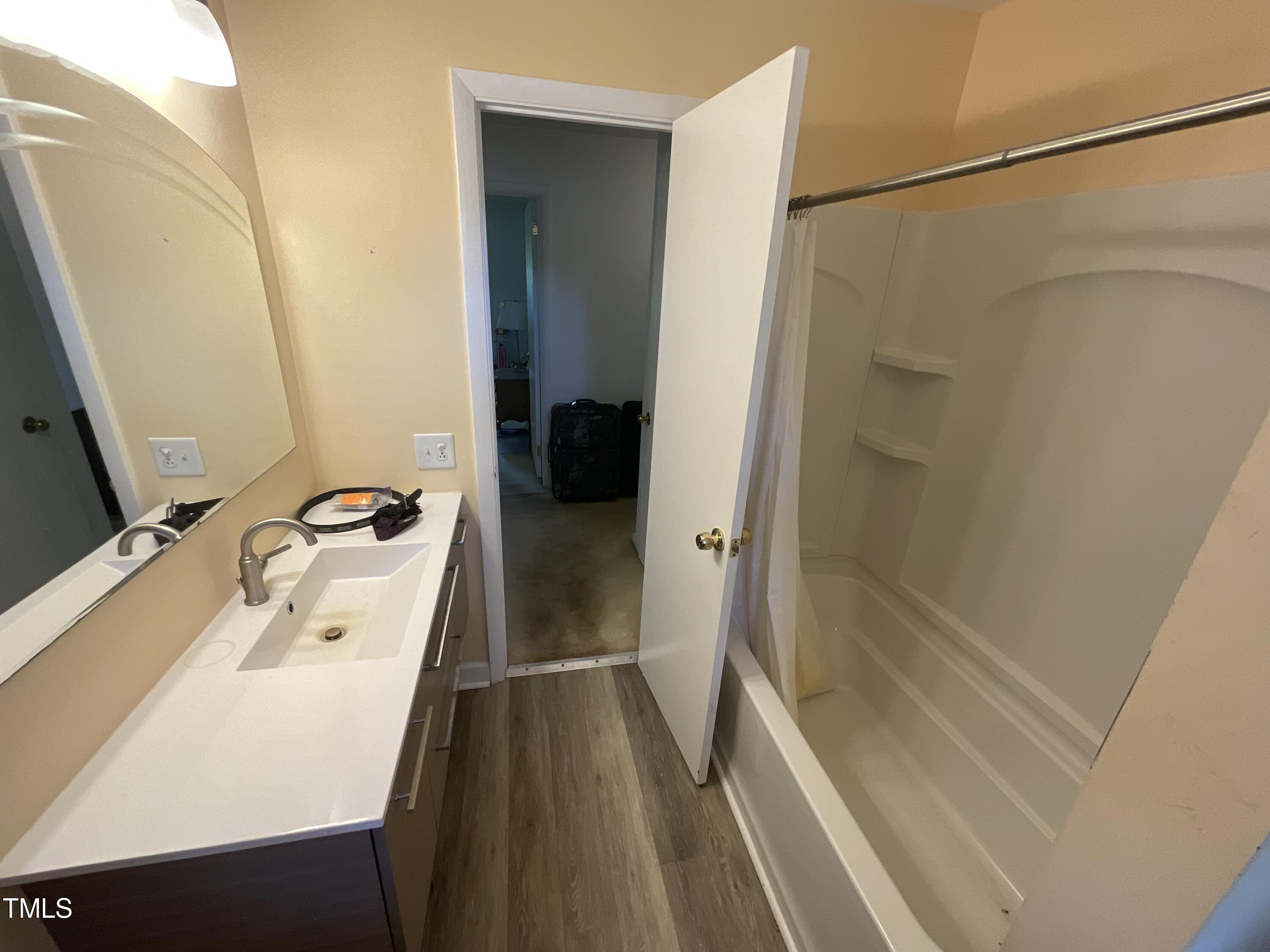 4540 Benson Road Angier, NC 27501 - Photo 23 of 27 a bathroom with a sink and a tub