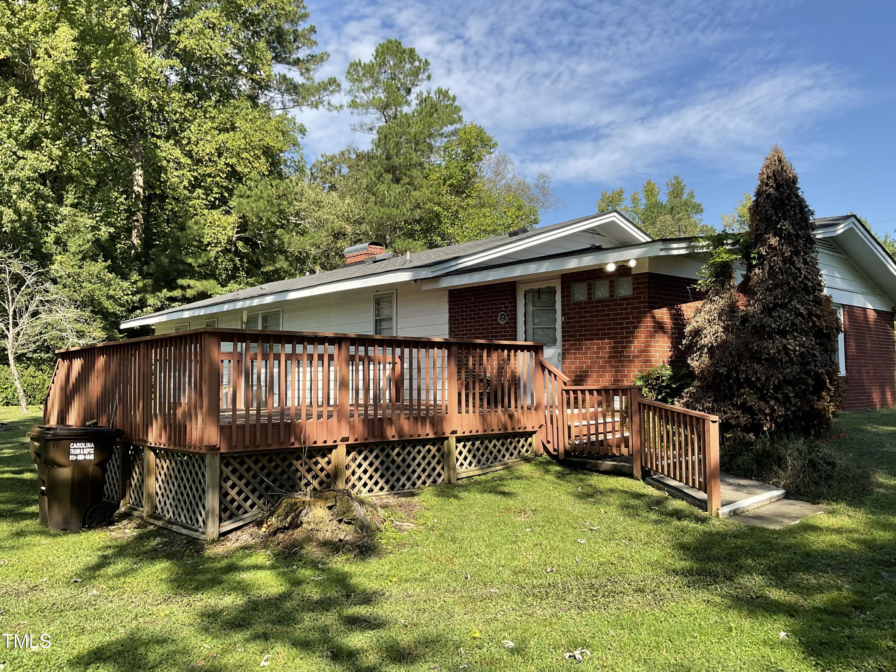4540 Benson Road Angier, NC 27501 - Photo 5 of 27 a view of a backyard with a tub