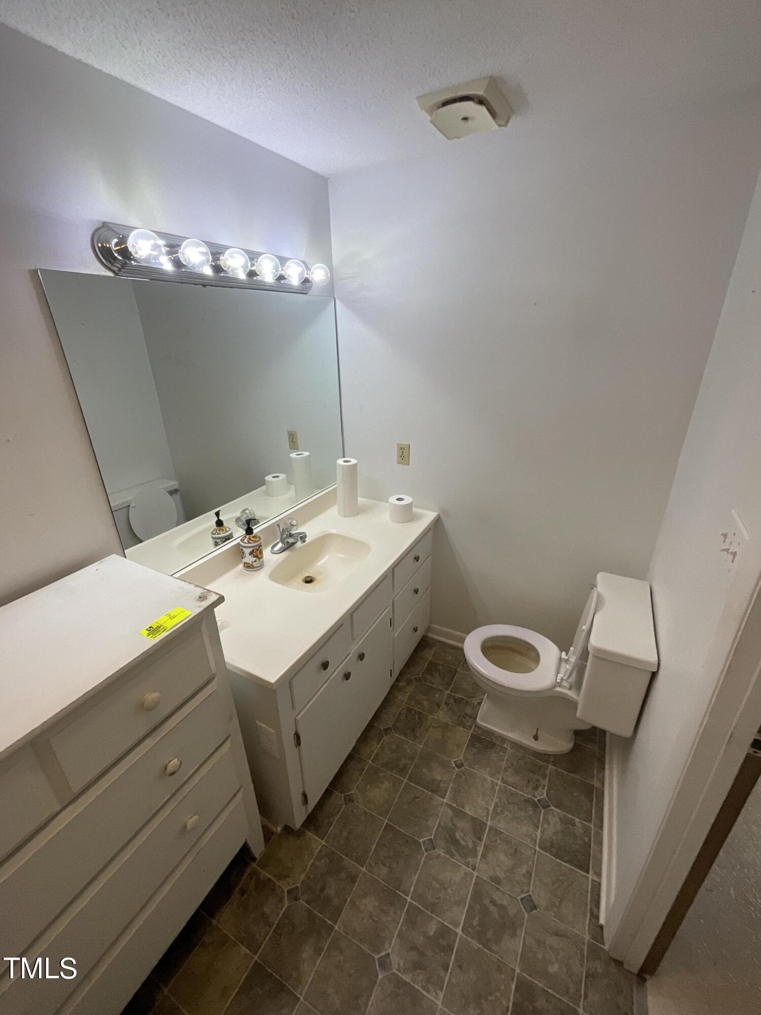 4540 Benson Road Angier, NC 27501 - Photo 6 of 27 a spacious bathroom with a double vanity sink and a mirror