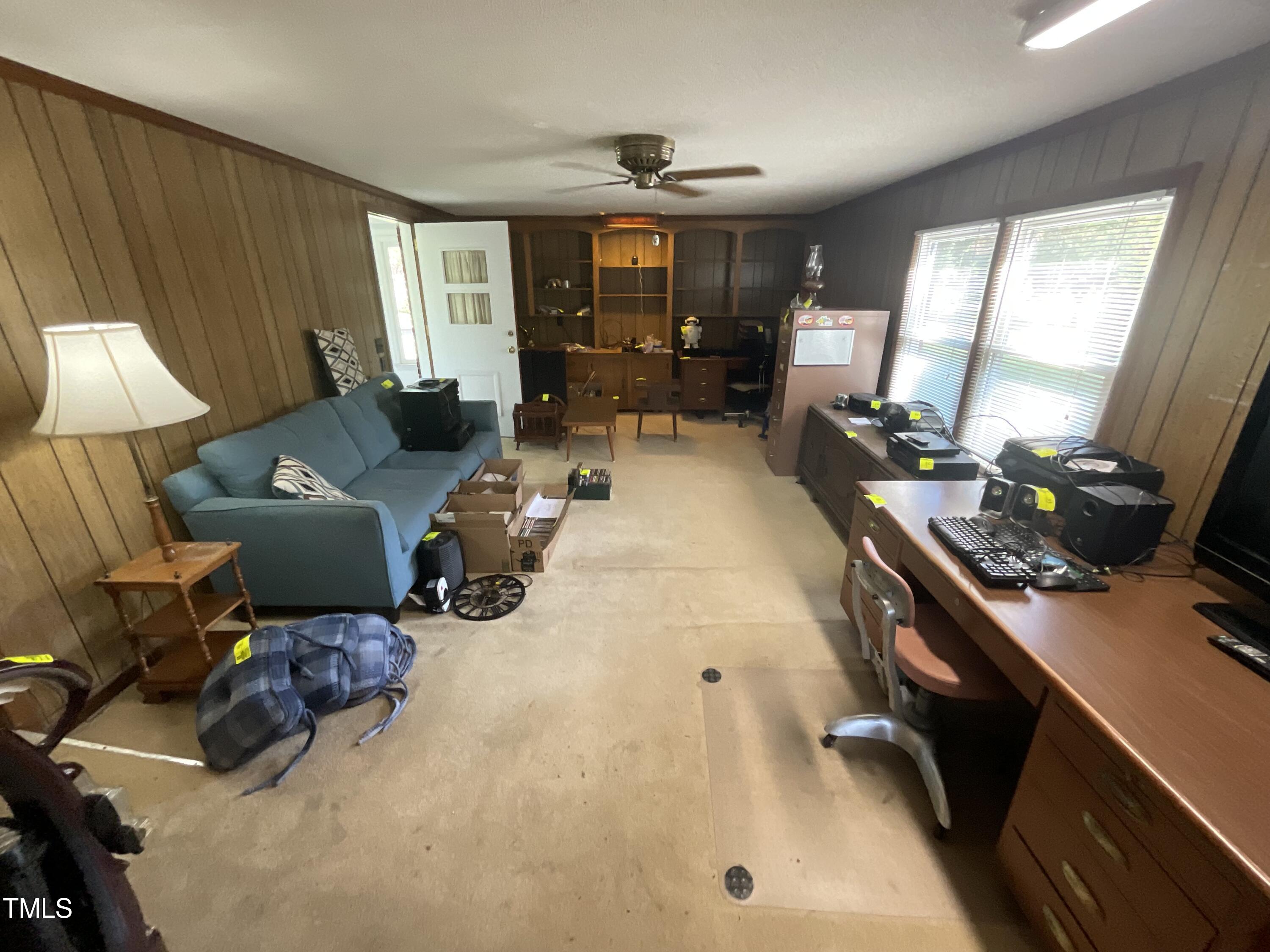 4540 Benson Road Angier, NC 27501 - Photo 10 of 27 a living room with furniture and a flat screen tv