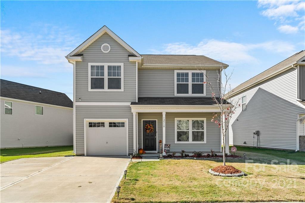 12510 Gotland Road Midland, NC 28107 - Photo 1 of 30 a front view of a house with a yard