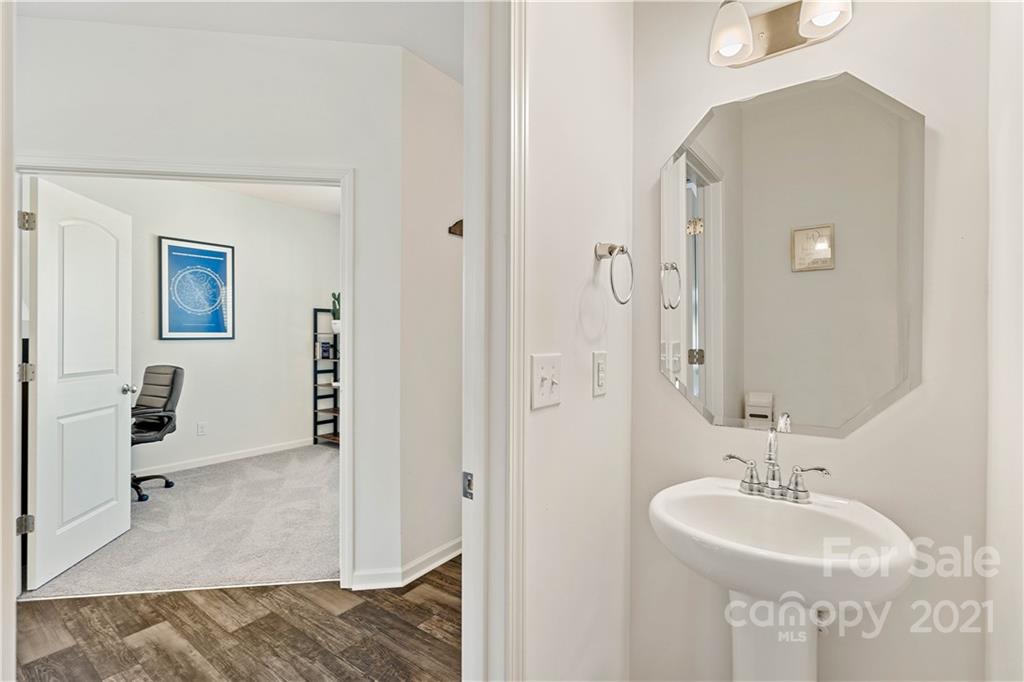 12510 Gotland Road Midland, NC 28107 - Photo 12 of 30 a bathroom with a sink a mirror and a shower