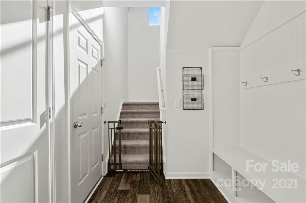 12510 Gotland Road Midland, NC 28107 - Photo 15 of 30 a view of a hallway with wooden floor and staircase