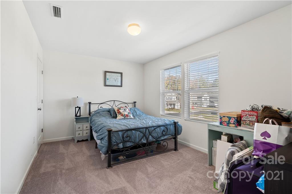 12510 Gotland Road Midland, NC 28107 - Photo 20 of 30 a bedroom with a bed and a window