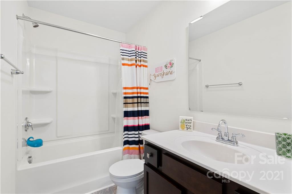 12510 Gotland Road Midland, NC 28107 - Photo 21 of 30 a bathroom with a sink toilet and shower