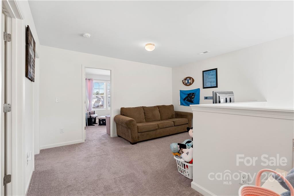 12510 Gotland Road Midland, NC 28107 - Photo 22 of 30 a living room with furniture and a window