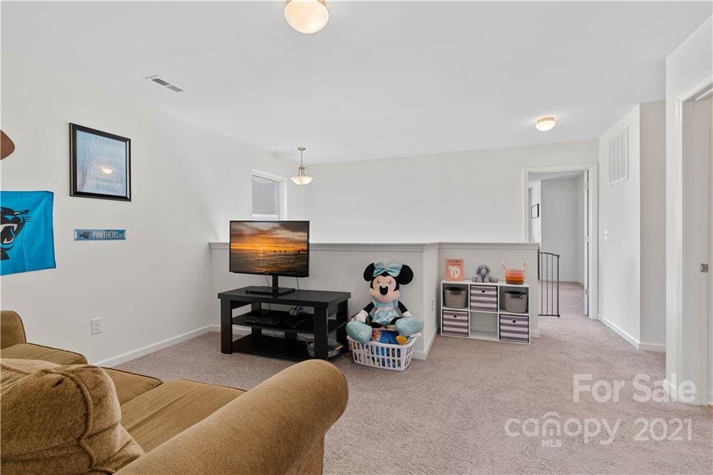 12510 Gotland Road Midland, NC 28107 - Photo 23 of 30 a bedroom with furniture and a fan
