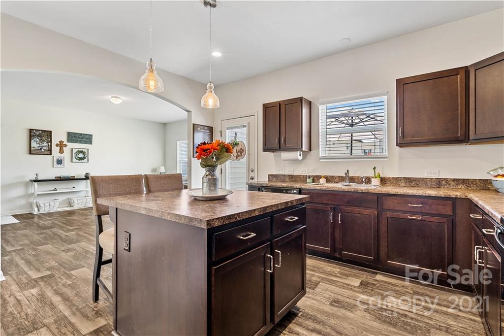 12510 Gotland Road Midland, NC 28107 - Photo 5 of 30 a kitchen with stainless steel appliances granite countertop a sink and cabinets