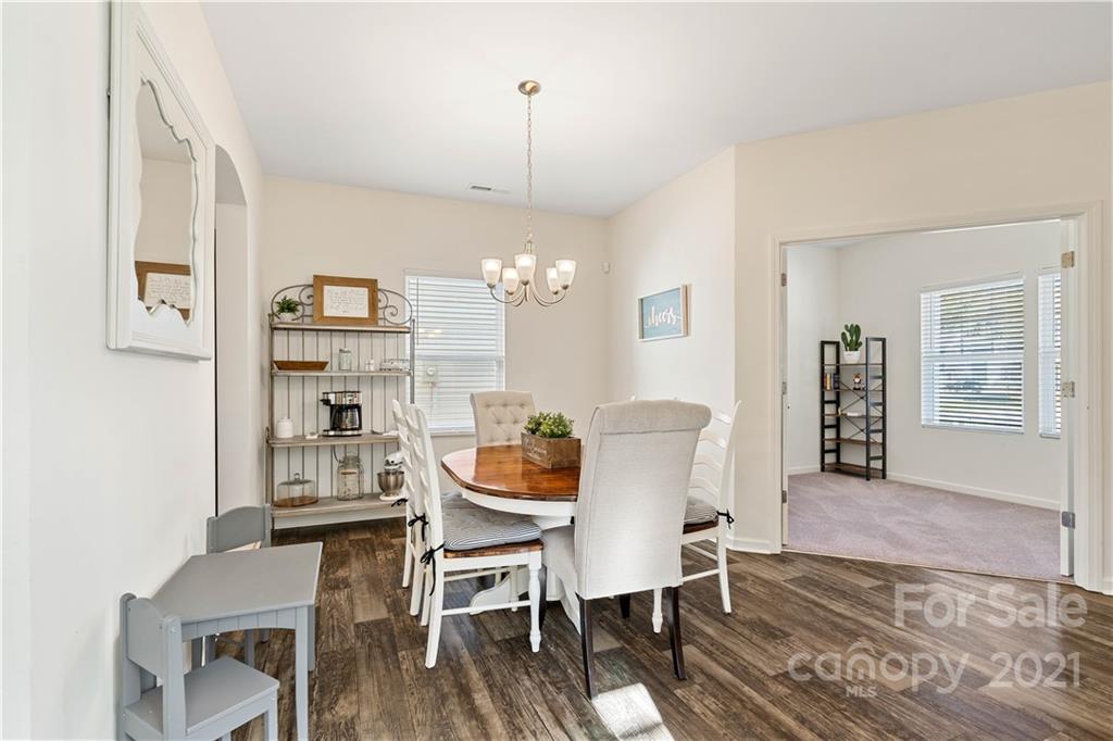 12510 Gotland Road Midland, NC 28107 - Photo 8 of 30 a view of a dining room with furniture and wooden floor