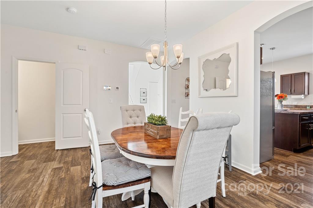 12510 Gotland Road Midland, NC 28107 - Photo 9 of 30 a view of a dining room with furniture and wooden floor