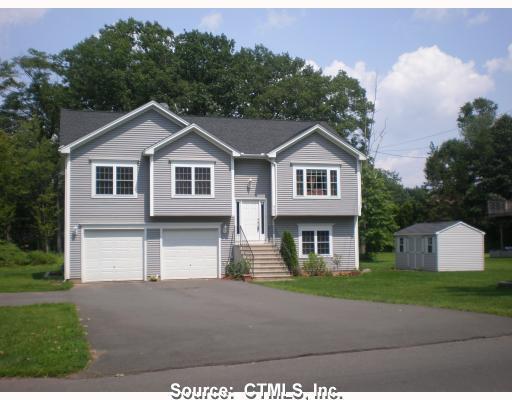 949 4 Rod Road Berlin, CT 06037 - Photo 1 of 1 a front view of a house with a yard and trees