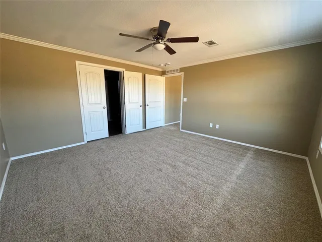 a view of a livingroom with a ceiling fan
