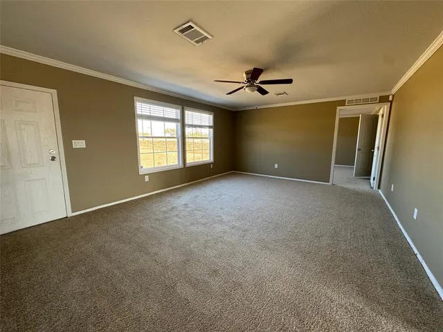 a view of empty room with windows