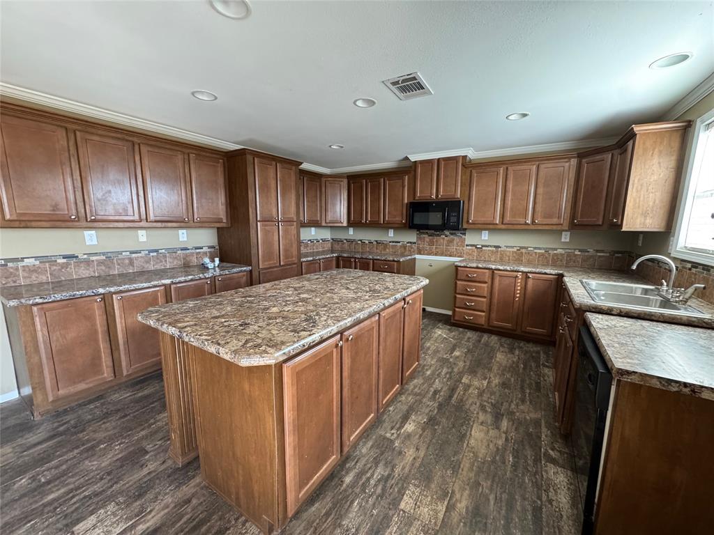 5481 Fm 1235 Merkel, TX 79536 - Photo 8 of 28 a kitchen with a stove sink and cabinets