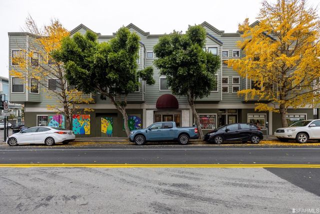 a building view with swimming pool in front of it