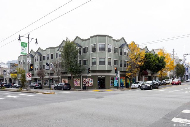 a view of a street with a building and a street