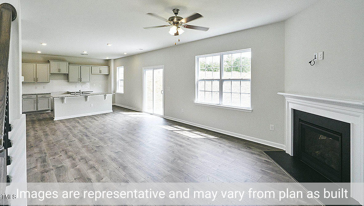 1702 Carter Daniel Drive Graham, NC 27253 - Photo 12 of 27 a view of an empty room with kitchen and window