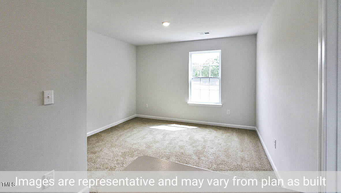 1702 Carter Daniel Drive Graham, NC 27253 - Photo 14 of 27 a view of an empty room and window
