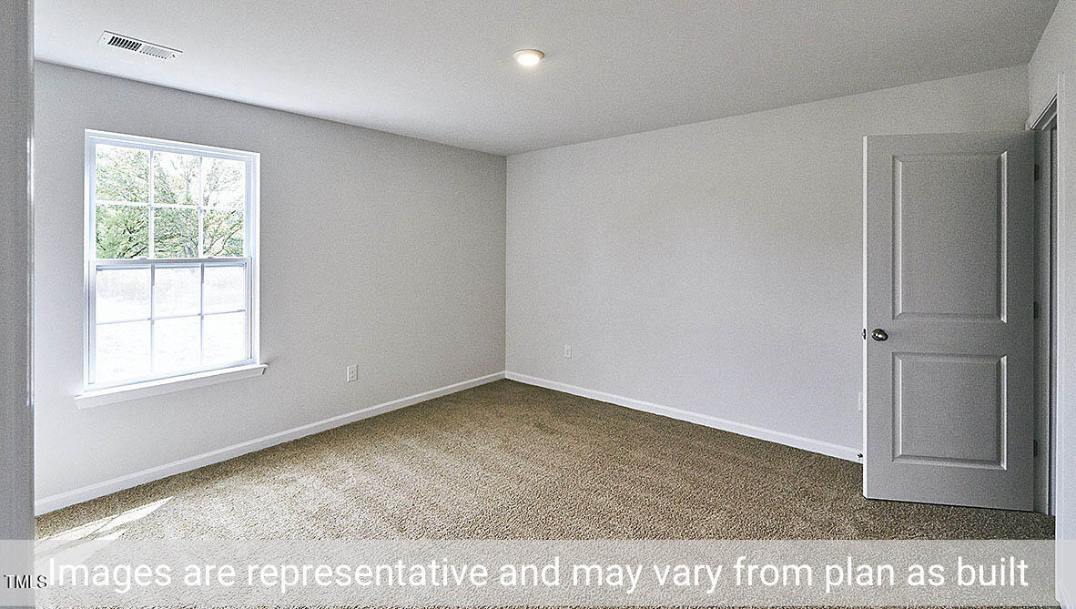 1702 Carter Daniel Drive Graham, NC 27253 - Photo 15 of 27 a view of an empty room with a window