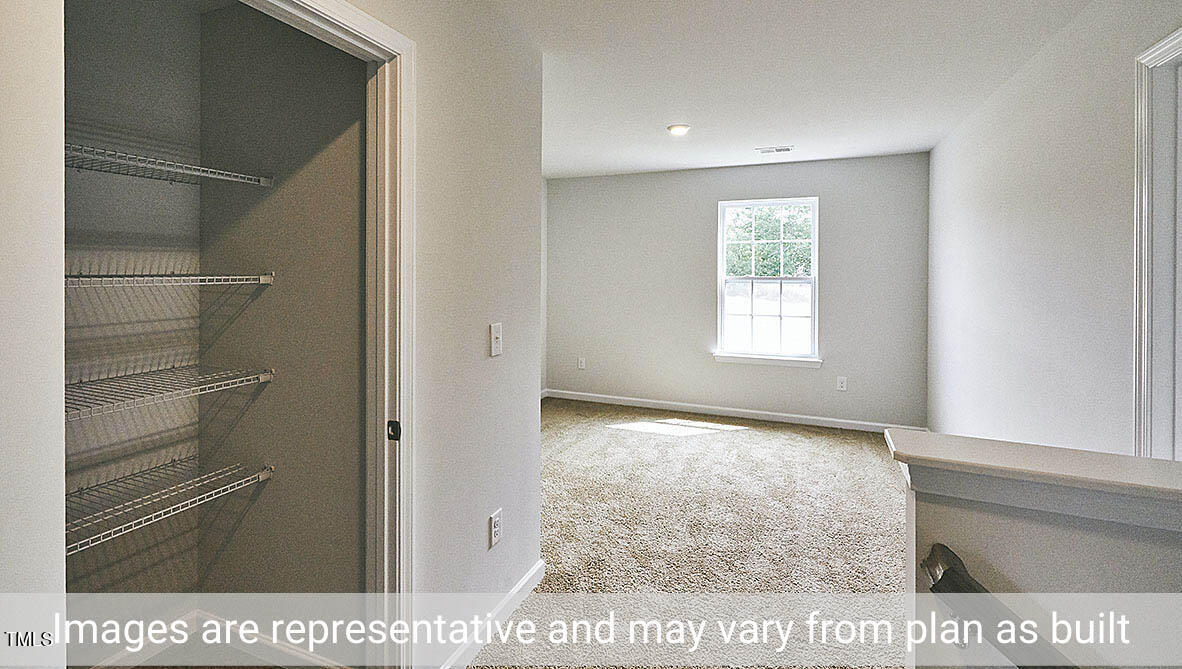 1702 Carter Daniel Drive Graham, NC 27253 - Photo 17 of 27 a view of an empty room with a window