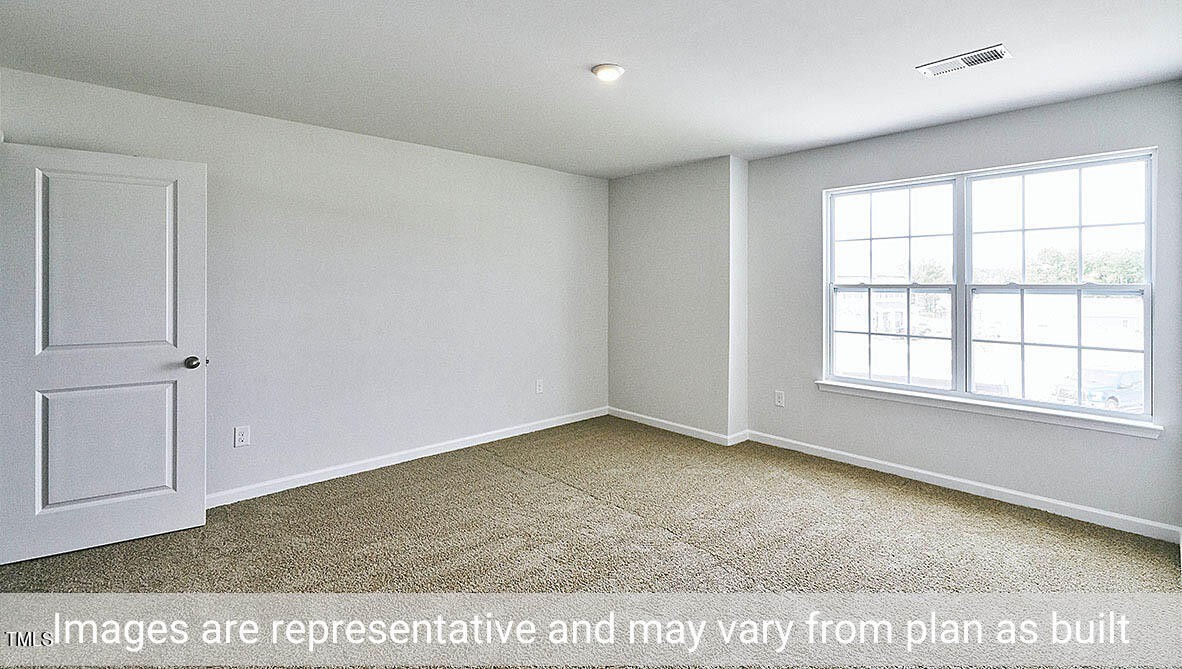 1702 Carter Daniel Drive Graham, NC 27253 - Photo 24 of 27 an empty room with windows