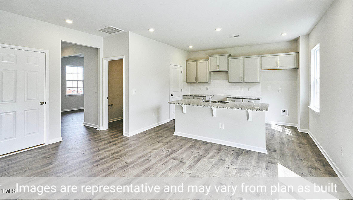 1702 Carter Daniel Drive Graham, NC 27253 - Photo 6 of 27 a view of kitchen with wooden floor