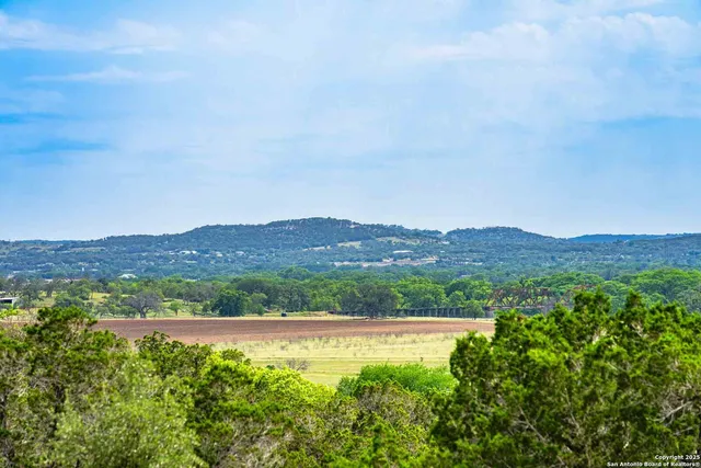 a view of a swimming pool with a yard
