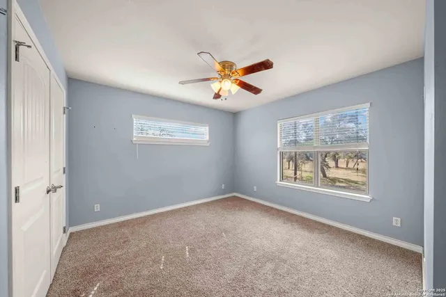 a bathroom with a shower and toilet