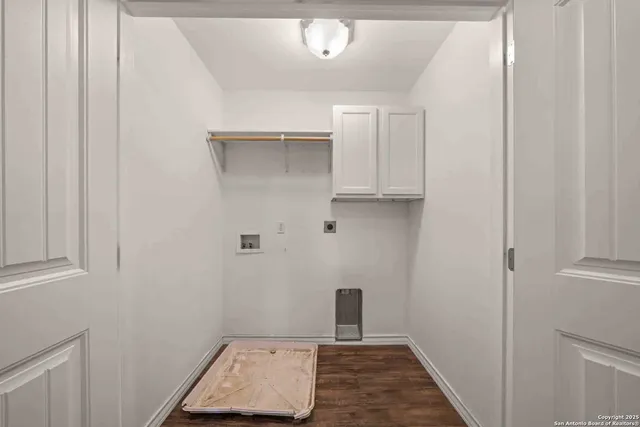 a front view of house with yard and trees in the background