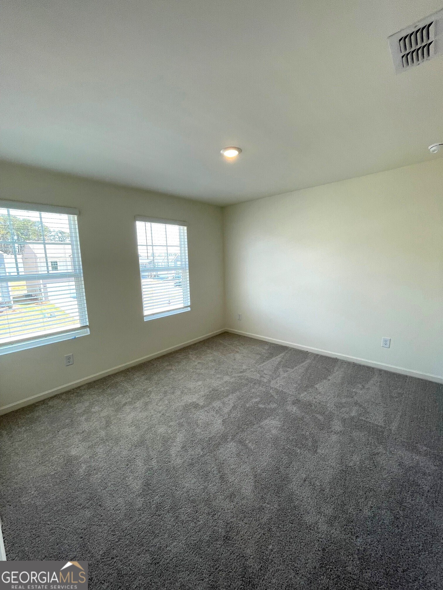 24 Rowlett Place Winder, GA 30680 - Photo 7 of 17 an empty room with windows