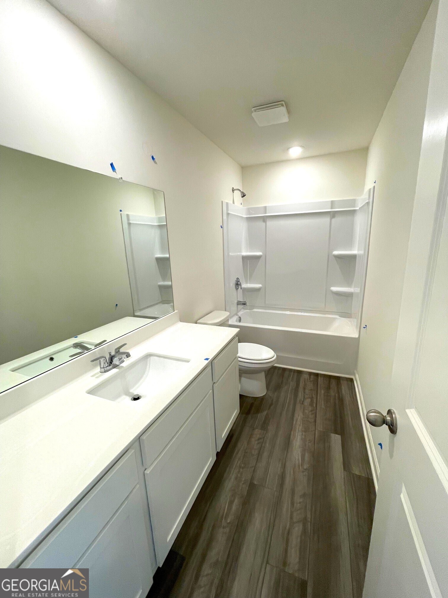 24 Rowlett Place Winder, GA 30680 - Photo 10 of 17 a spacious bathroom with a tub sink shower and a mirror