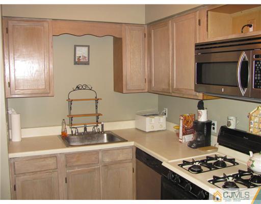 111 Orlando Street Edison, NJ 08817 - Photo 1 of 5 a kitchen with a stove and a sink