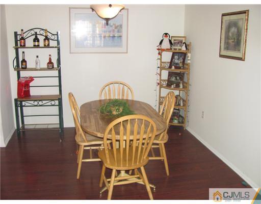 111 Orlando Street Edison, NJ 08817 - Photo 2 of 5 a view of a dining room with furniture and wooden floor