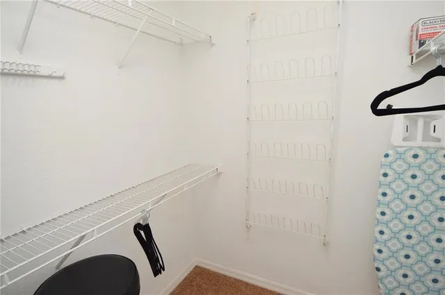 a white toilet sitting next to a bathroom sink